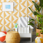 Parasol wallpaper is designed with overlapping shapes of multicolored beach umbrellas. Highly durable, fade resistant, and made in the USA. This wallpaper has a yellow print on white background and is designed in collaboration with The Aesthetics of Joy.