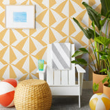 Parasol wallpaper is designed with overlapping shapes of multicolored beach umbrellas. Highly durable, fade resistant, and made in the USA. This wallpaper has a yellow print on white background and is designed in collaboration with The Aesthetics of Joy.