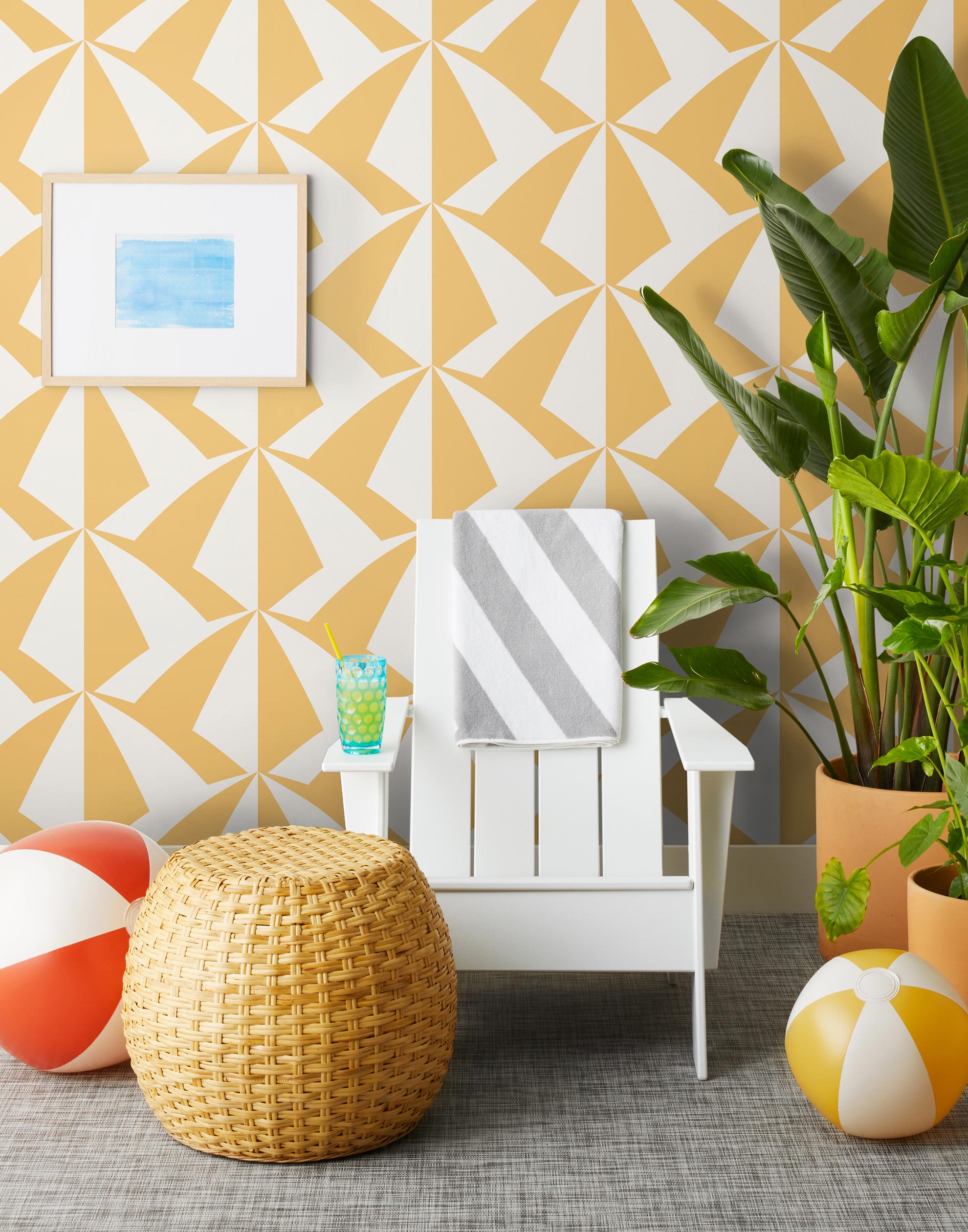 Parasol wallpaper is designed with overlapping shapes of multicolored beach umbrellas. Highly durable, fade resistant, and made in the USA. This wallpaper has a yellow print on white background and is designed in collaboration with The Aesthetics of Joy.