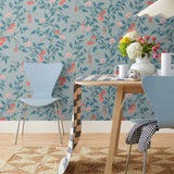 Our Heirloom wallpaper celebrates the annual arrival of tomato season. Highly durable, fade resistant, and made in the USA. This wallpaper features red and peach tomatoes, pink flowers and blue vines on a light blue background and was created in collaboration with The Aesthetics of Joy.