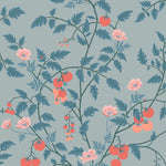 Our Heirloom wallpaper celebrates the annual arrival of tomato season. Highly durable, fade resistant, and made in the USA. This wallpaper features red and peach tomatoes, pink flowers and blue vines on a light blue background and was created in collaboration with The Aesthetics of Joy.