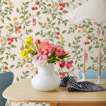 Our Heirloom wallpaper celebrates the annual arrival of tomato season. Highly durable, fade resistant, and made in the USA. This wallpaper features red and pink tomatoes, yellow flowers and green vines on a pink background and was created in collaboration with The Aesthetics of Joy.