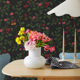 Our Heirloom wallpaper celebrates the annual arrival of tomato season. Highly durable, fade resistant, and made in the USA. This wallpaper features red and orange tomatoes, pink flowers and green vines on a black background and was created in collaboration with The Aesthetics of Joy.