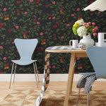 Our Heirloom wallpaper celebrates the annual arrival of tomato season. Highly durable, fade resistant, and made in the USA. This wallpaper features red and orange tomatoes, pink flowers and green vines on a black background and was created in collaboration with The Aesthetics of Joy.