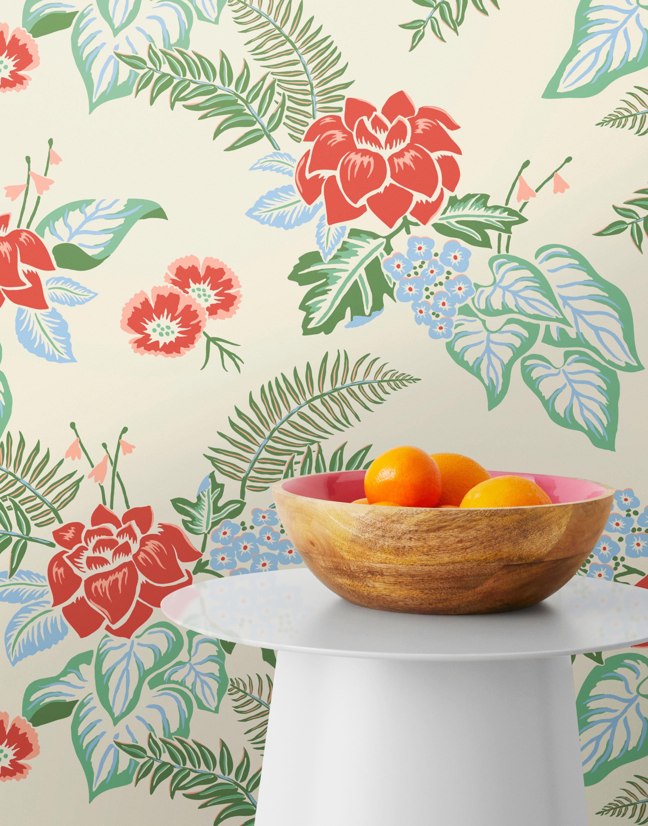 Our Lanai wallpaper is inspired by the rich tradition and exuberant patterns of Hawaiian shirts, with a twist. Highly durable, fade resistant, and made in the USA. This wallpaper features red flowers with green and blue leaves on a cream background and was created in collaboration with The Aesthetics of Joy.