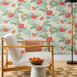 Our Lanai wallpaper is inspired by the rich tradition and exuberant patterns of Hawaiian shirts, with a twist. Highly durable, fade resistant, and made in the USA. This wallpaper features red flowers with green and blue leaves on a cream background and was created in collaboration with The Aesthetics of Joy.
