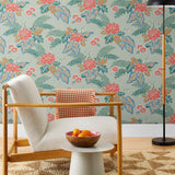 Our Lanai wallpaper is inspired by the rich tradition and exuberant patterns of Hawaiian shirts, with a twist. Highly durable, fade resistant, and made in the USA. This wallpaper features pink flowers with green and blue leaves on a mint green background and was created in collaboration with The Aesthetics of Joy.