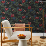 Our Lanai wallpaper is inspired by the rich tradition and exuberant patterns of Hawaiian shirts, with a twist. Highly durable, fade resistant, and made in the USA. This wallpaper features red flowers with green and blue leaves on a black background and was created in collaboration with The Aesthetics of Joy.
