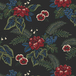 Our Lanai wallpaper is inspired by the rich tradition and exuberant patterns of Hawaiian shirts, with a twist. Highly durable, fade resistant, and made in the USA. This wallpaper features red flowers with green and blue leaves on a black background and was created in collaboration with The Aesthetics of Joy.