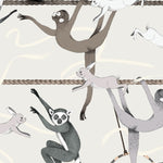 Balancing Act (Cream) wallpaper features colorful dancing monkeys and rabbits on a cream background