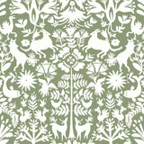 Folklore (Fern) features white animals and flowers in a mirroring pattern on a soft green backgroud designed by Emily Isabella for Hygge & West