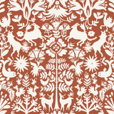 Folklore (Terracotta) features white animals and flowers in a mirroring pattern on a terracotta red backgroud designed by Emily Isabella for Hygge & West