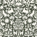 Folklore (Sage) features white animals and flowers in a mirroring pattern on a sage green backgroud designed by Emily Isabella for Hygge & West