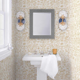 Storyline (Goldenrod) Wallpaper | Folk art inspired pattern featuring flora and fauna in ochre yellow on a white ground