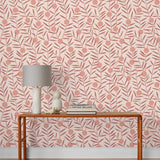 Bloom (Blush) Wallpaper featuring peach dots and mauve stems on a soft pink ground in a modern, graphic floral