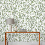 Bloom (Sage) Wallpaper featuring green dots and stems on an off white ground in a modern, graphic floral