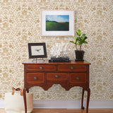 Piedmont (Blush) wallpaper with pink foxes, taupe flora, white accents on a light pink background
