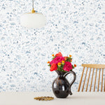 Willows Wallpaper features leaves swaying, chickens pecking, fisherman fishing, children playing, and mothers mothering as they dance beneath the swaying willows. Painted by hand in shades of blue on a white background. Hillery Sproatt + Hygge & West