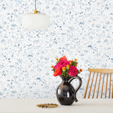 Willows Wallpaper features leaves swaying, chickens pecking, fisherman fishing, children playing, and mothers mothering as they dance beneath the swaying willows. Painted by hand in shades of blue on a white background. Hillery Sproatt + Hygge & West