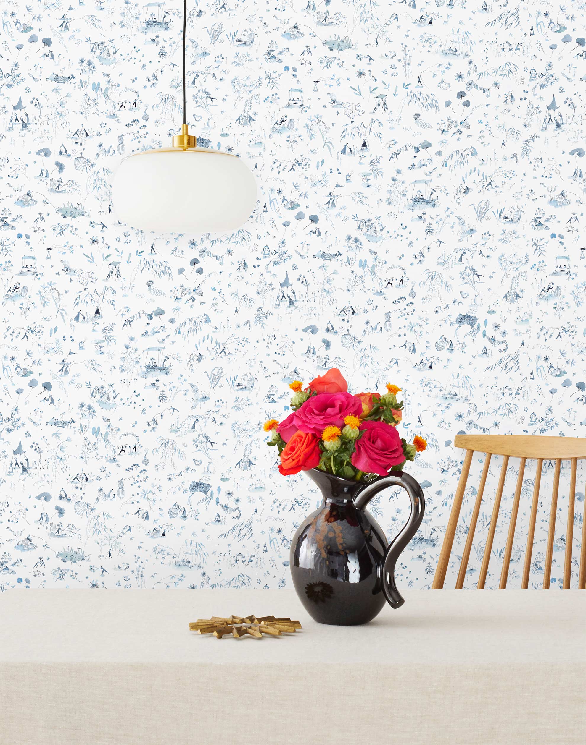 Willows Wallpaper features leaves swaying, chickens pecking, fisherman fishing, children playing, and mothers mothering as they dance beneath the swaying willows. Painted by hand in shades of blue on a white background. Hillery Sproatt + Hygge & West