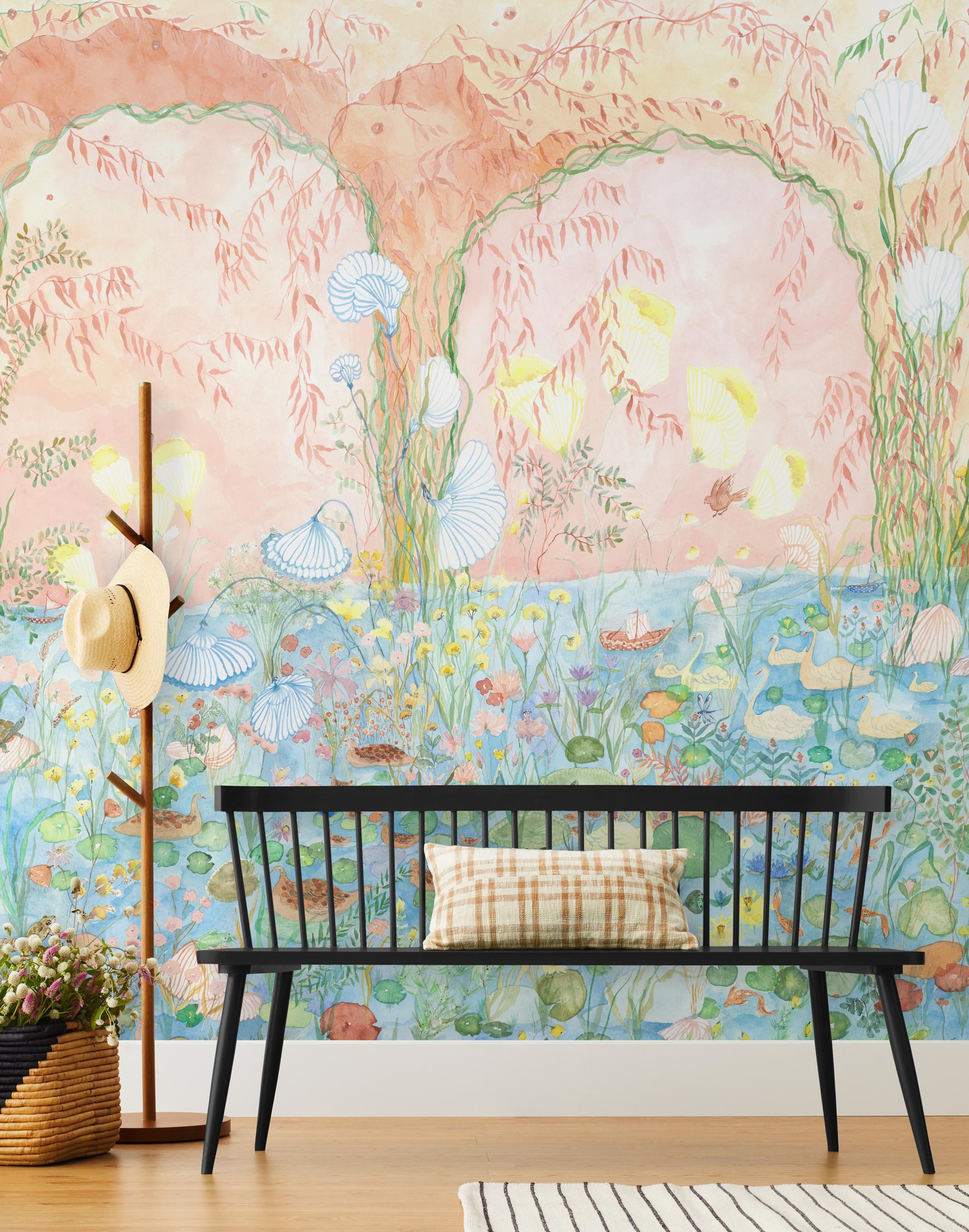 Watercolored swans, turtles, frogs, and fish swim in a flora filled pond beneath an arch of climbing plants and grasses. Lily Pond Mural contains a rainbow of soft watercolors - yellow, peach, apricot, green and blue. Hillery Sproat + Hygge & West