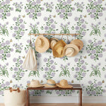 This large-scale wallpaper features hand drawn bees, butterflies and other garden friends frolic among flowers - camellias, hellebores, irises, and snowball trees. Harmony (Ebony) is printed in shades of green and purple on a white background.