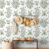 This large-scale wallpaper features hand drawn bees, butterflies and other garden friends frolic among flowers - camellias, hellebores, irises, and snowball trees. Harmony (Ebony) is printed in shades of green and purple on a white background.