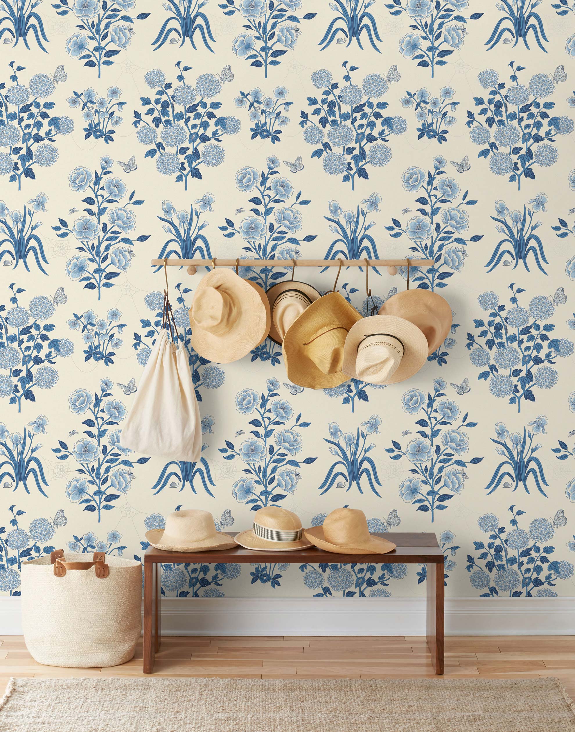 This large-scale wallpaper features hand drawn bees, butterflies and other garden friends frolic among flowers - camellias, hellebores, irises, and snowball trees. Harmony (Porcelain) is printed in shades of blue on a cream background.