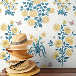 This large-scale wallpaper features hand drawn bees, butterflies and other garden friends frolic among flowers - camellias, hellebores, irises, and snowball trees. Harmony (Flax) is printed in shades of green and yellow on an off white background.