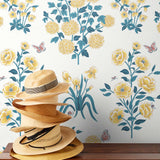 This large-scale wallpaper features hand drawn bees, butterflies and other garden friends frolic among flowers - camellias, hellebores, irises, and snowball trees. Harmony (Flax) is printed in shades of green and yellow on an off white background.