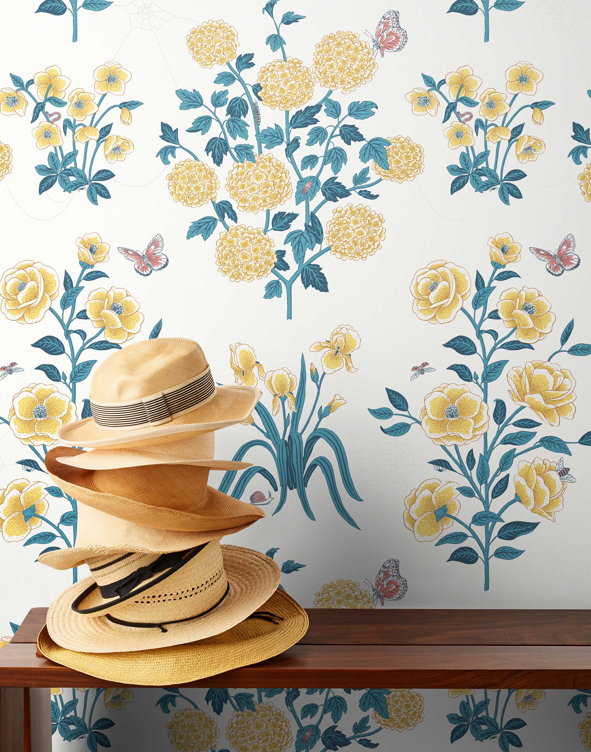 This large-scale wallpaper features hand drawn bees, butterflies and other garden friends frolic among flowers - camellias, hellebores, irises, and snowball trees. Harmony (Flax) is printed in shades of green and yellow on an off white background.