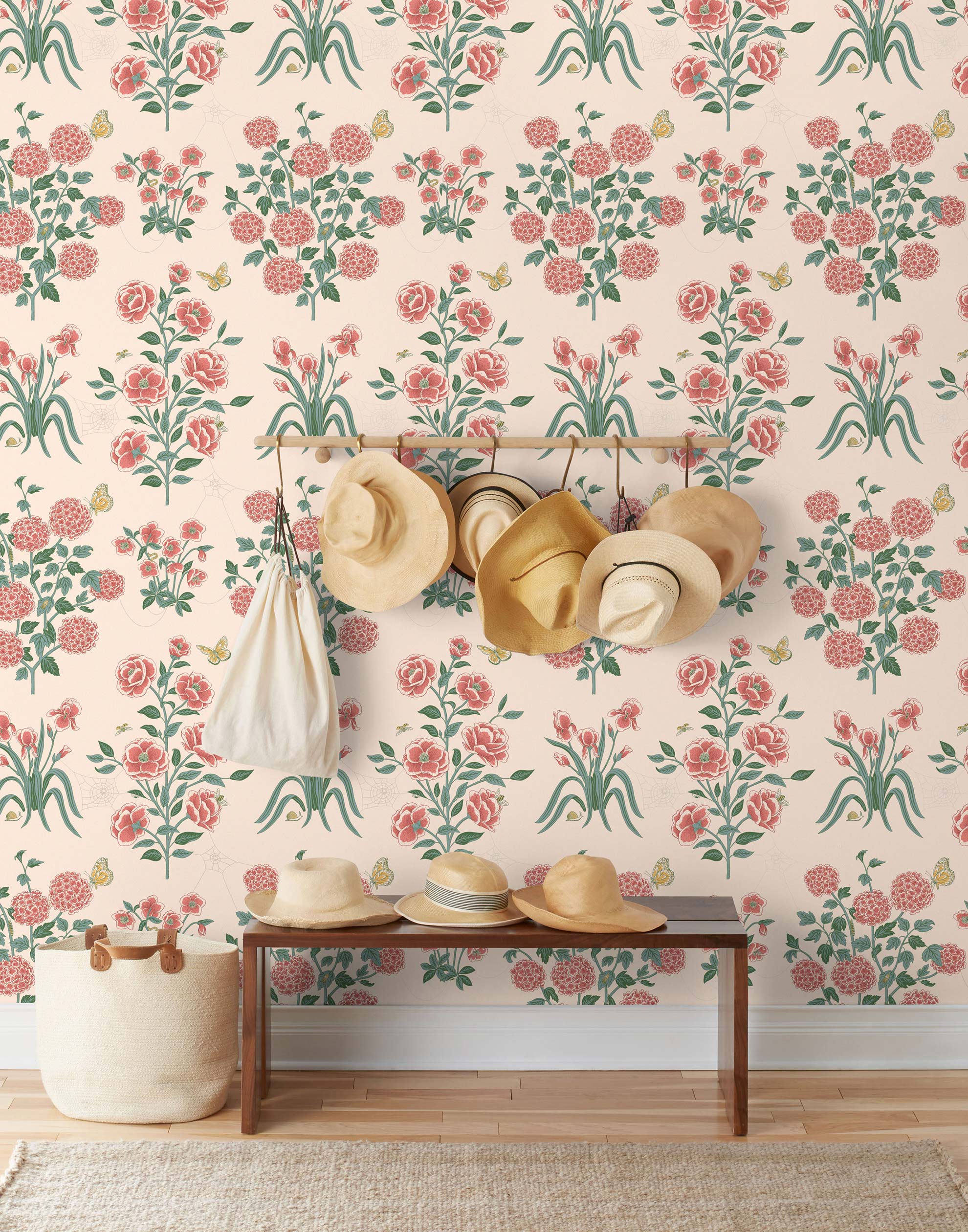 This large-scale wallpaper features hand drawn bees, butterflies and other garden friends frolic among flowers - camellias, hellebores, irises, and snowball trees. Harmony (Blush) is printed in shades of green and pink on a blush background.