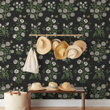 This large-scale wallpaper features hand drawn bees, butterflies and other garden friends frolic among flowers - camellias, hellebores, irises, and snowball trees. Harmony (Ebony) is printed in shades of green and white on a black background.