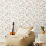 Our Serengeti wallpaper features beige cheetahs and pink birds scattered among peach acacia trees on a white background, reflecting the powerful beauty of the vast plains. Designed by Julia Rothman and made in the USA.