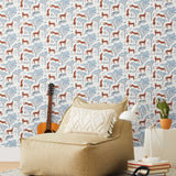 Our Serengeti wallpaper features orange cheetahs and navy birds scattered among blue acacia trees on a white background, reflecting the powerful beauty of the vast plains. Designed by Julia Rothman and made in the USA.