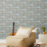 Our Serengeti wallpaper features brown cheetahs and birds scattered among white acacia trees on a dusty blue background, reflecting the powerful beauty of the vast plains. Designed by Julia Rothman and made in the USA.