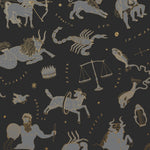 Our In the Stars wallpaper is inspired by Urania’s Mirror, a 19th-century set of astrology charts. This hand-drawn pattern evokes the mysterious motion of celestial bodies. This wallpaper features gray and gold motifs on a black background and was designed by Julia Rothman.