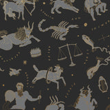 Our In the Stars wallpaper is inspired by Urania’s Mirror, a 19th-century set of astrology charts. This hand-drawn pattern evokes the mysterious motion of celestial bodies. This wallpaper features gray and gold motifs on a black background and was designed by Julia Rothman.