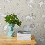 Our In the Stars wallpaper is inspired by Urania’s Mirror, a 19th-century set of astrology charts. This hand-drawn pattern evokes the mysterious motion of celestial bodies. This wallpaper features white and black motifs on a cream background and was designed by Julia Rothman.