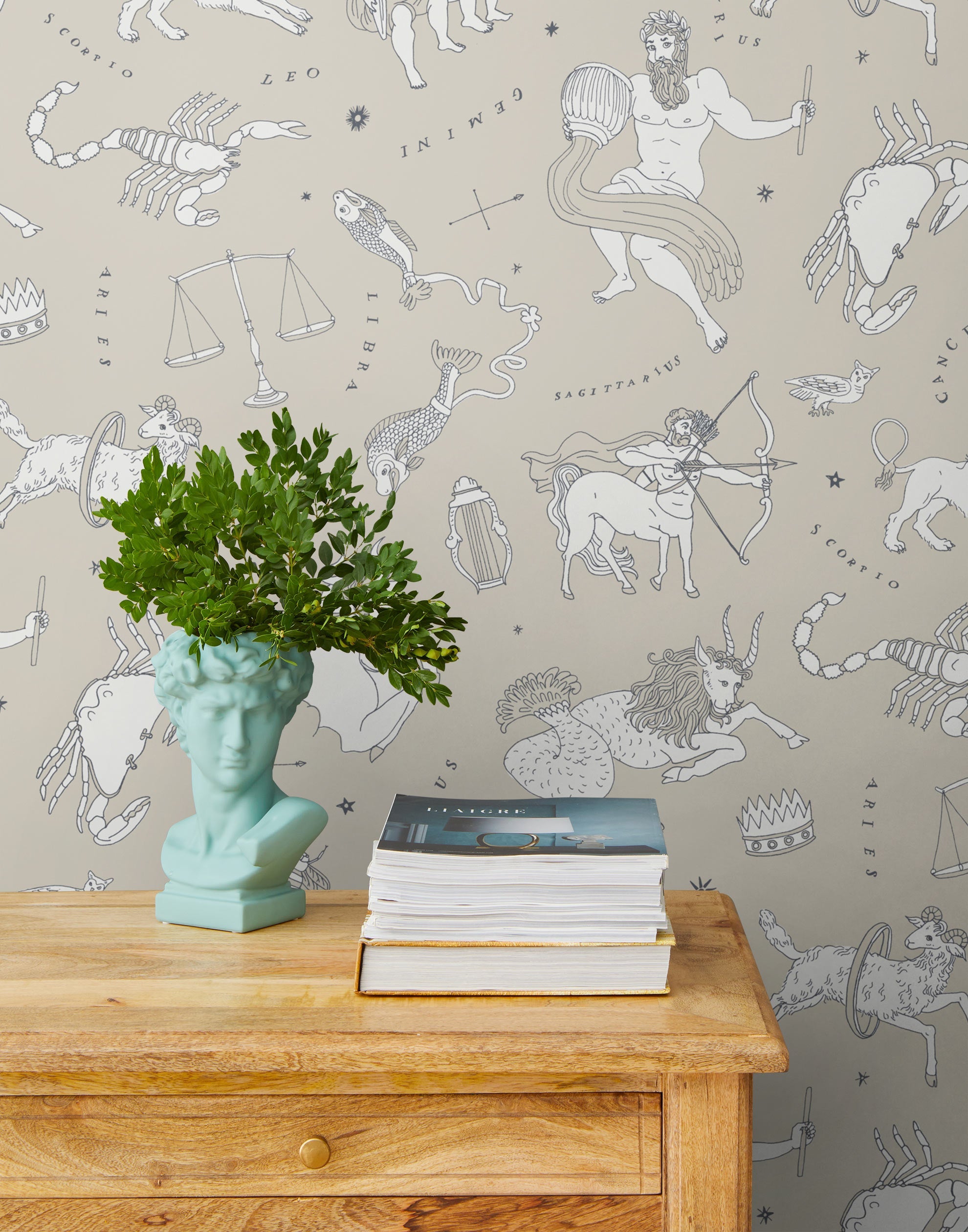 Our In the Stars wallpaper is inspired by Urania’s Mirror, a 19th-century set of astrology charts. This hand-drawn pattern evokes the mysterious motion of celestial bodies. This wallpaper features white and black motifs on a cream background and was designed by Julia Rothman.