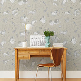 Our In the Stars wallpaper is inspired by Urania’s Mirror, a 19th-century set of astrology charts. This hand-drawn pattern evokes the mysterious motion of celestial bodies. This wallpaper features white and black motifs on a cream background and was designed by Julia Rothman.