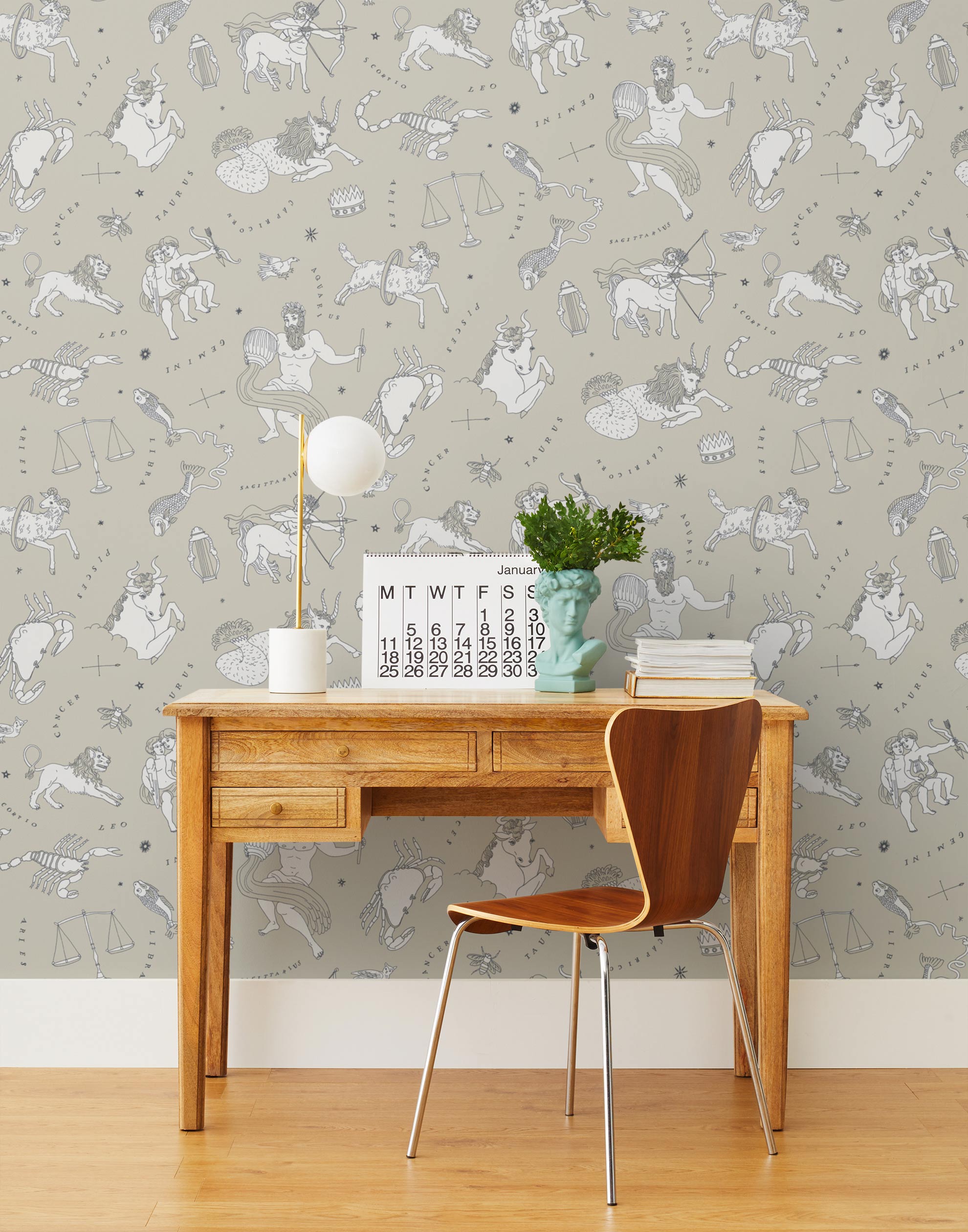 Our In the Stars wallpaper is inspired by Urania’s Mirror, a 19th-century set of astrology charts. This hand-drawn pattern evokes the mysterious motion of celestial bodies. This wallpaper features white and black motifs on a cream background and was designed by Julia Rothman.