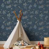 Our In the Stars wallpaper is inspired by Urania’s Mirror, a 19th-century set of astrology charts. This hand-drawn pattern evokes the mysterious motion of celestial bodies. This wallpaper features blue and gold motifs on a navy background and was designed by Julia Rothman.