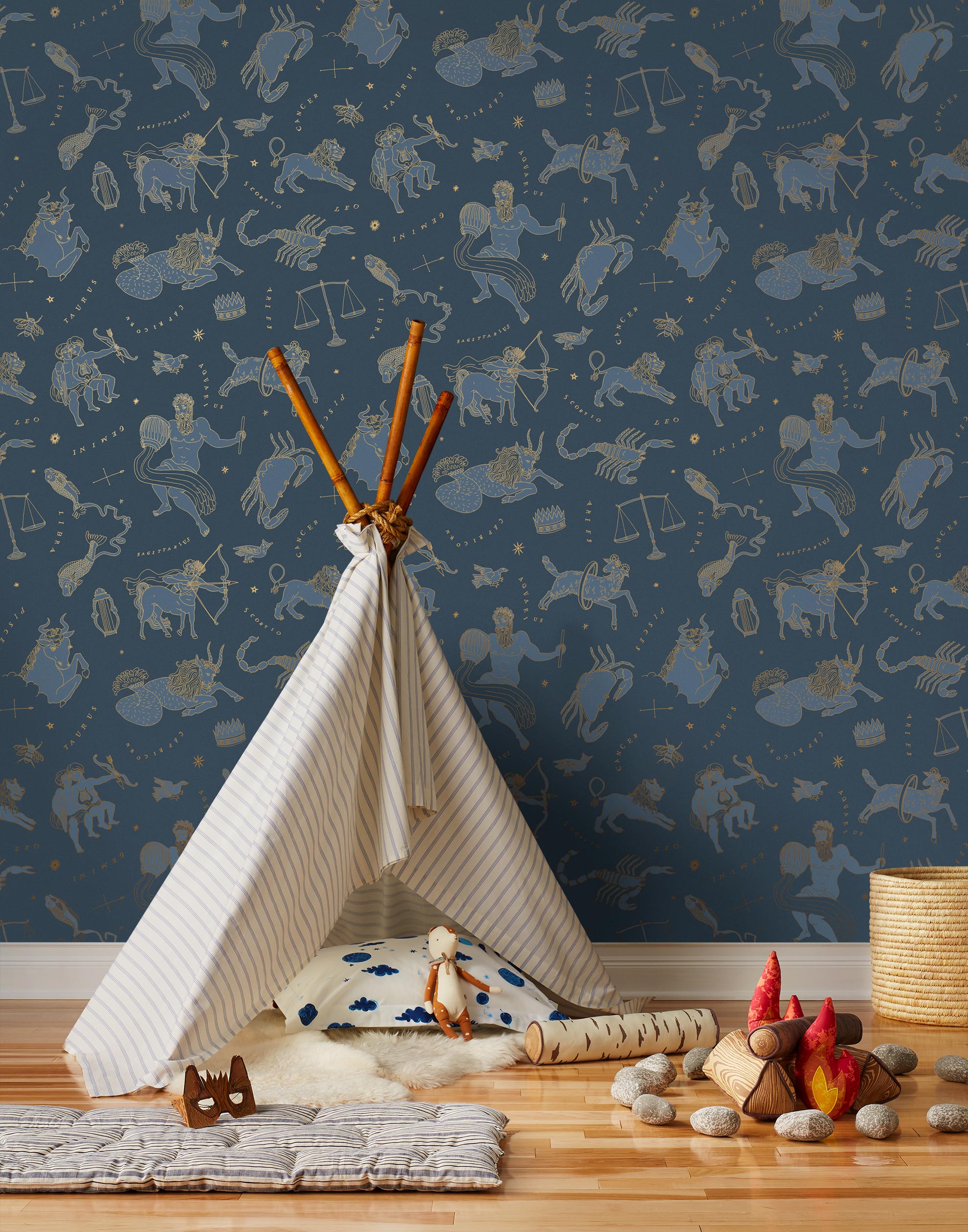 Our In the Stars wallpaper is inspired by Urania’s Mirror, a 19th-century set of astrology charts. This hand-drawn pattern evokes the mysterious motion of celestial bodies. This wallpaper features blue and gold motifs on a navy background and was designed by Julia Rothman.