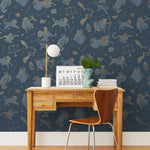 Our In the Stars wallpaper is inspired by Urania’s Mirror, a 19th-century set of astrology charts. This hand-drawn pattern evokes the mysterious motion of celestial bodies. This wallpaper features blue and gold motifs on a navy background and was designed by Julia Rothman.