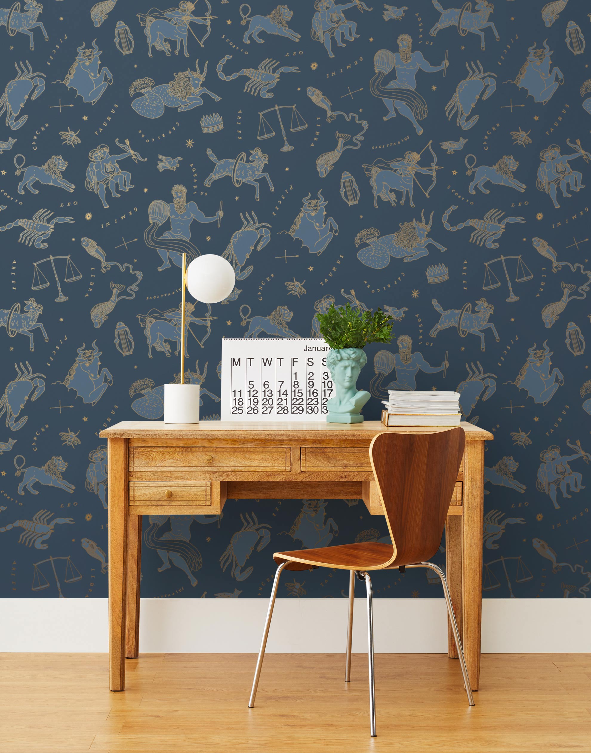 Our In the Stars wallpaper is inspired by Urania’s Mirror, a 19th-century set of astrology charts. This hand-drawn pattern evokes the mysterious motion of celestial bodies. This wallpaper features blue and gold motifs on a navy background and was designed by Julia Rothman.