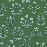 Chance (Juniper) wallpaper features intricately illustrated flowers and herbs in white and blue on a green background.