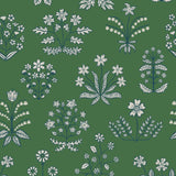 Chance (Juniper) wallpaper features intricately illustrated flowers and herbs in white and blue on a green background.