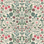 Nora (Blush) wallpaper features a garden of bees, birds, strawberries, and flowers in green, blue and red on a pink background.