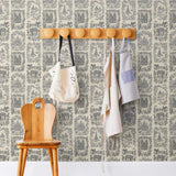 Je T'aime Paris (Parchment) wallpaper featuring gray illustrations of Paris landmarks on a cream background | Nathalie Lete + Hygge & West